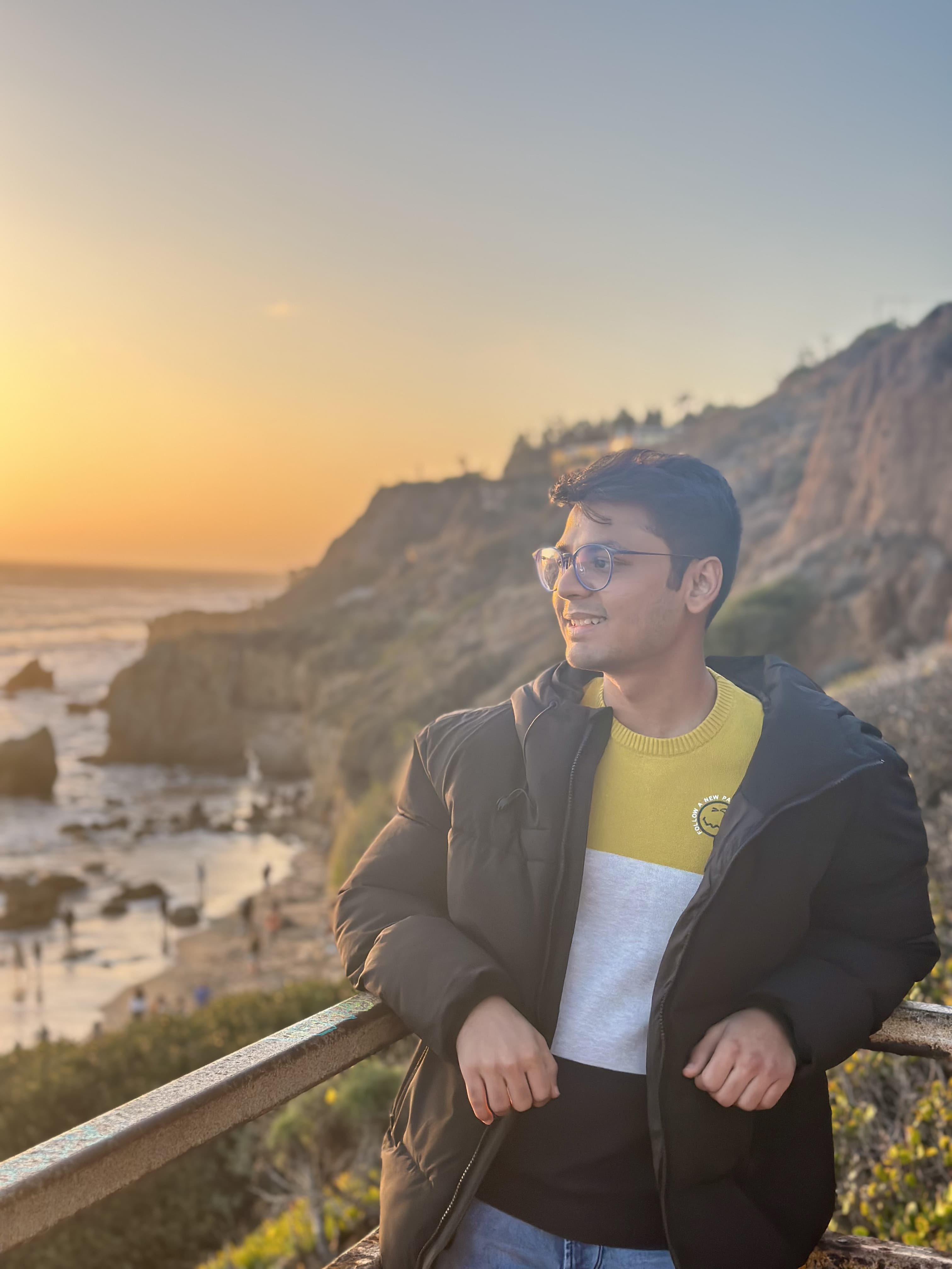 Rushank Shah smiling outdoors